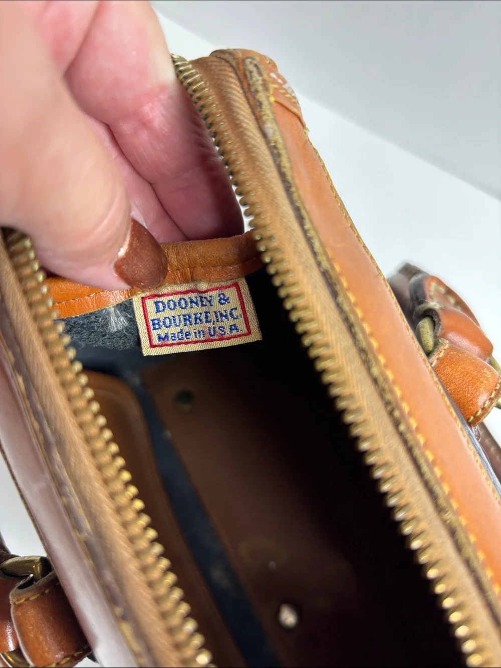 Dooney & Bourke Black Pebbled Leather Satchel with Tan Trim